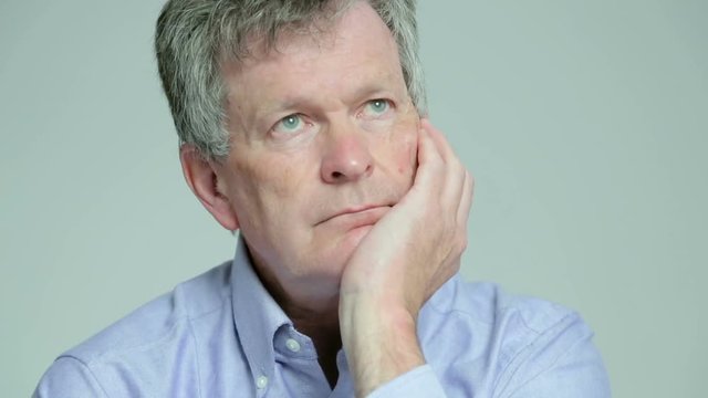 Depressed, sad man looks into space