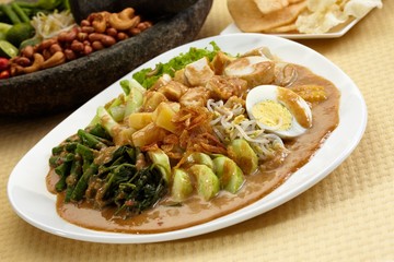 Fried vegetables salad with potatoes, morning glory, boiled eggs