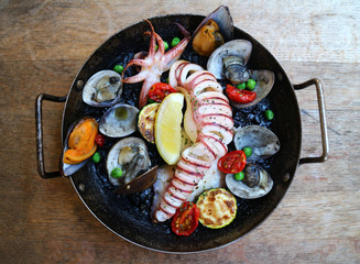 Spainish international cuisine orthodox with fried squid, clams,