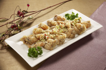 Abalone salt and pepper flavors Apricot on white plate in restau