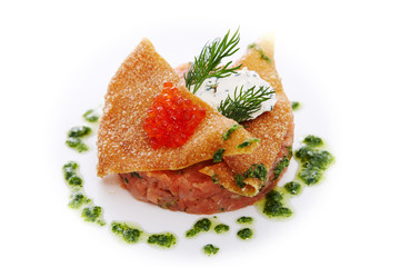 Tartar of smoked salmon with spicy cream cheese, celery and red