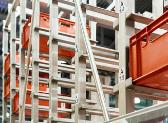 Red plastic boxes in the cells of the automated warehouse.