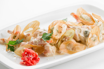 Sauteed tiger prawns in a sauce Ber Blanc on white plate backgro