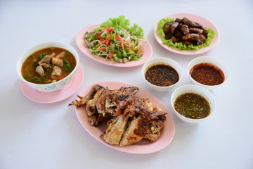 Meal for dinner with fried chicken, chili fish sauce, vegetables