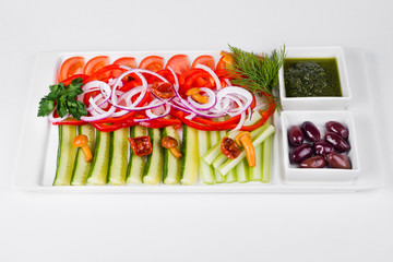 Assorted vegetables with sliced cucumber, tomatoes, chili, onion