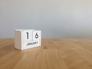 January 16th.January 16 white wooden calendar on wood background