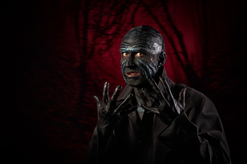 Studio portrait of a man in monster makeup