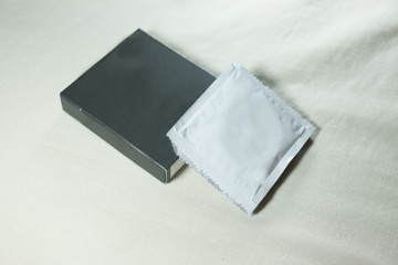Condom with silver condom packages