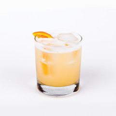 Glass of Whiskey sour with orange in white background