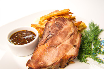 Baked ham of pork neck, stewed in wine with garlic Crans served