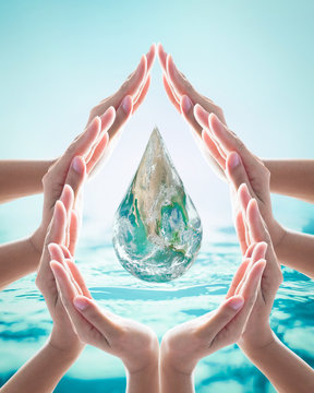 Collaborative female human hands in droplet shape on blurred wavy clean water background: Saving water clean natural environment ocean concept/ campaign: Elements of this image furnished by NASA