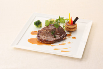 Beef rib roast steak on white plate background