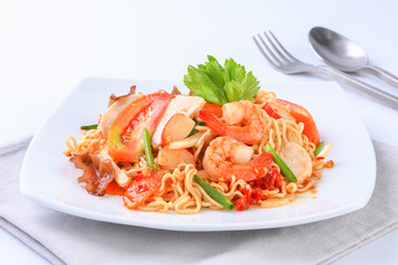 Instant noodle spicy salad on white plate