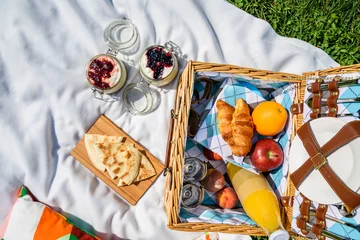 Papier Peint photo autocollant Pique-nique Picnic Basket With Fruits, Orange Juice, Croissants, Quesadilla And No Bake Blueberry And Strawberry Jam Cheesecake