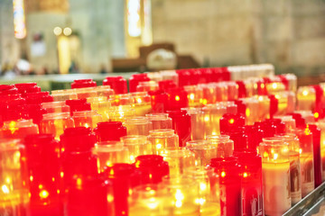 Church burning candles in glass candlesticks in the Cathedral.