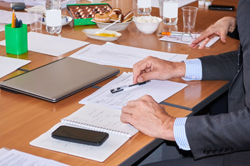 male hand at the negotiating table