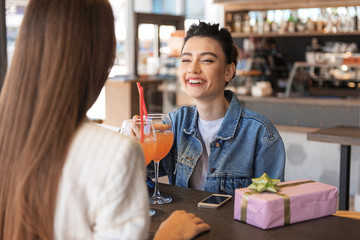 female friends talking in a cafe