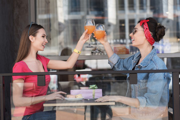 women drinking on a terrace