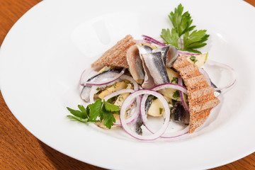 Salad with potatoes sprat and onions