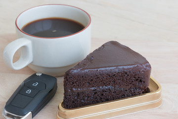chocolate cake and coffee on the table.