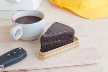 chocolate cake and coffee on the table.