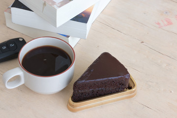 chocolate cake and coffee on the table.