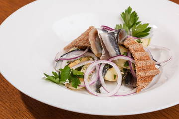 Salad with potatoes sprat and onions