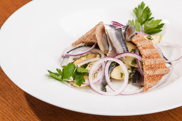 Salad with potatoes sprat and onions