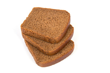 Sliced black rye bread on white background