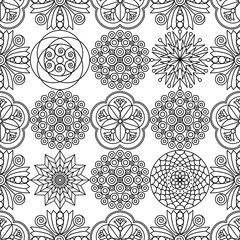 Seamless pattern of botanical doodles. Black & white cute flowers' ornament for coloring book pages, gift wrap & textile prints.