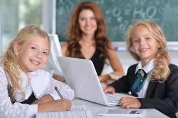 teacher with two girls at lesson