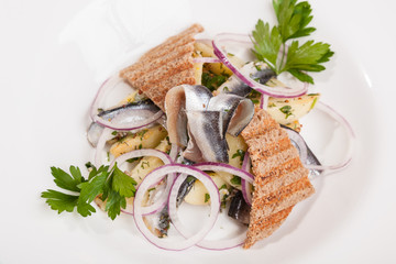 Salad with potatoes sprat and onions