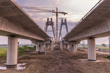 Cable stayed bridge under construction in the morning