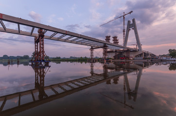 Cable stayed bridge under construction in the morning