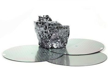 wafers with piece of polycrystalline silicon isolated on white background