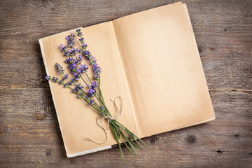 l bouquet of lavender on an old book