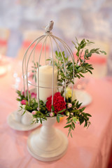 Beautiful wedding restaurant for marriage. White decor for bride and groom. Colorful decoration for celebration. Beauty bridal interior. Bouquet, food and flowers in hall