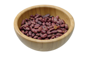 Dried red bean in wooden bowl and on white background