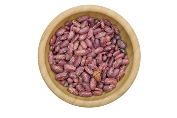 Dried red bean in wooden bowl and on white background