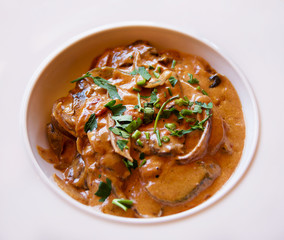 Beef Stroganoff with fresh parsley , close up