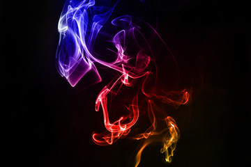 Abstract colorful smoke on the black background