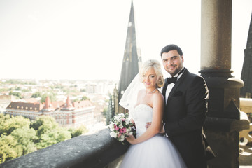 Gorgeous wedding couple walking in the old city of Lviv