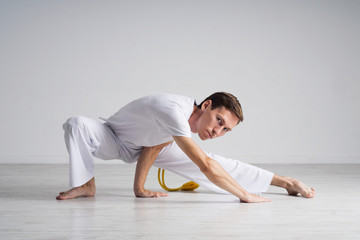 Young man doing stretching exercises