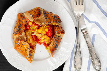 Spicy rye galettes with tomatoes, corn and ricotta