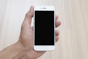 Hand holding a cellphone.