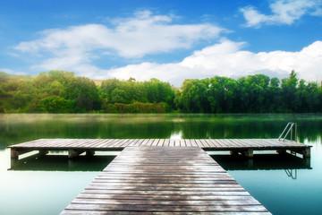 a lake with a boardwalk