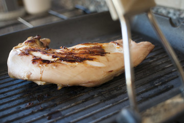 grilled chicken breast on a griddle