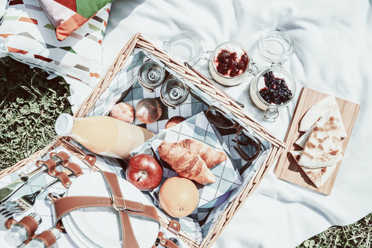 Picnic Basket With Fruits, Orange Juice, Croissants, Quesadilla