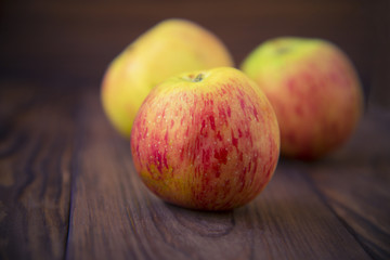 Apples on wooden background