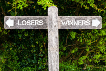 LOSERS versus WINNERS directional signs